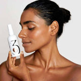 Women Holding FAB Skincare No.3 Chemical Peel Bottle